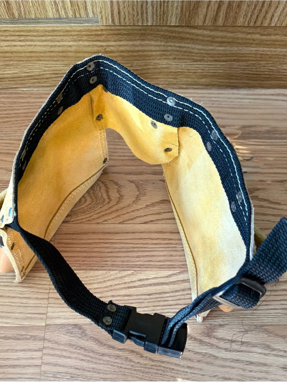 Suede leather Tool-belt that says ”Daddy Helper”n large gold letters in front.